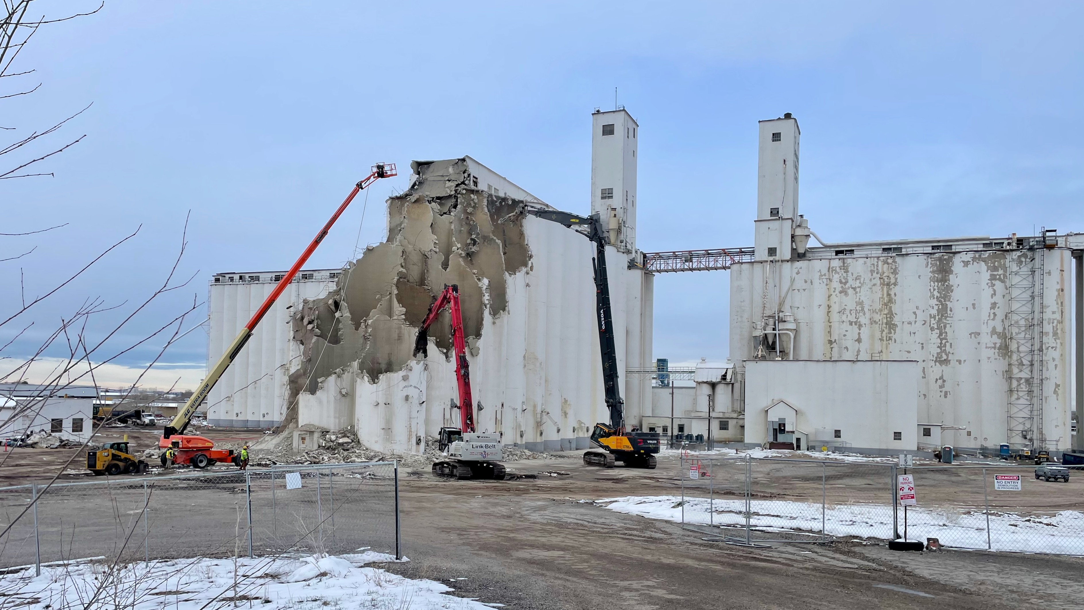 The old Farmers Grain Cooperative grain elevator in west Ogden is being demolished Tuesday. Built in 1941, its demise underscores the changing local economy and shift from agriculture.