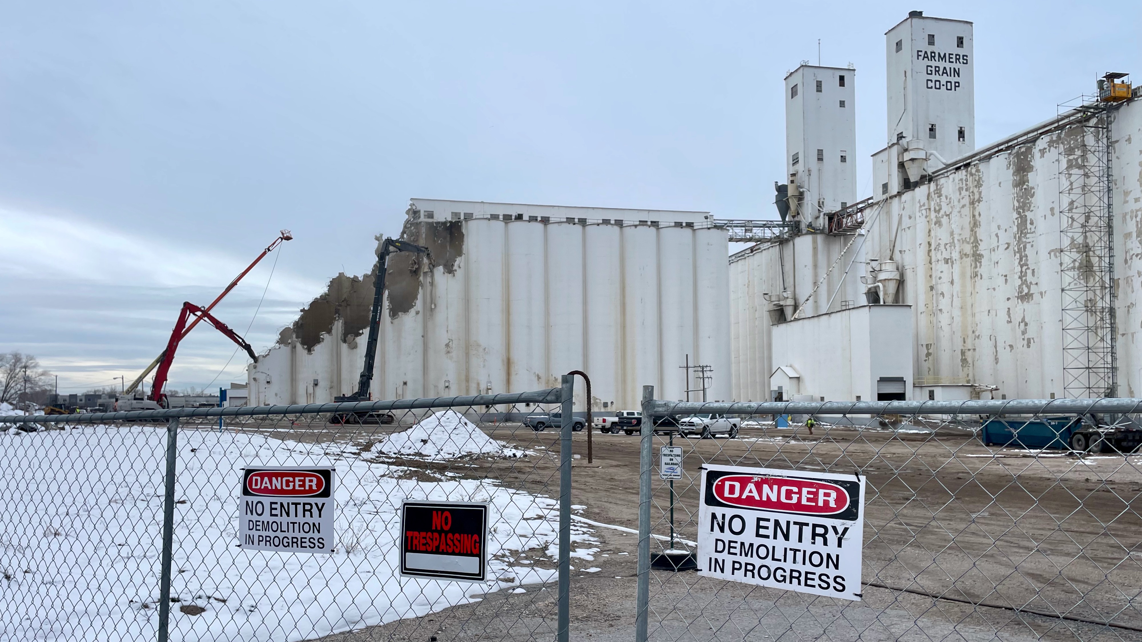 The old Farmers Grain Cooperative grain elevator in west Ogden, photographed Tuesday, is now being demolished. Built in 1941, its demise underscores the changing local economy and shift from agriculture.