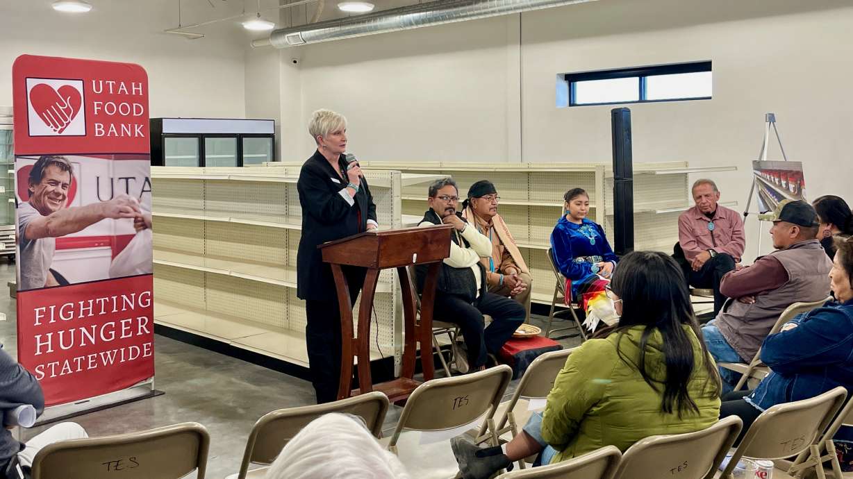 Ginette Bott, the Utah Food Bank president and chief executive officer, addresses a gathering at the inauguration on Wednesday of a new food pantry in Monument Valley that's meant to serve the Navajo Nation.