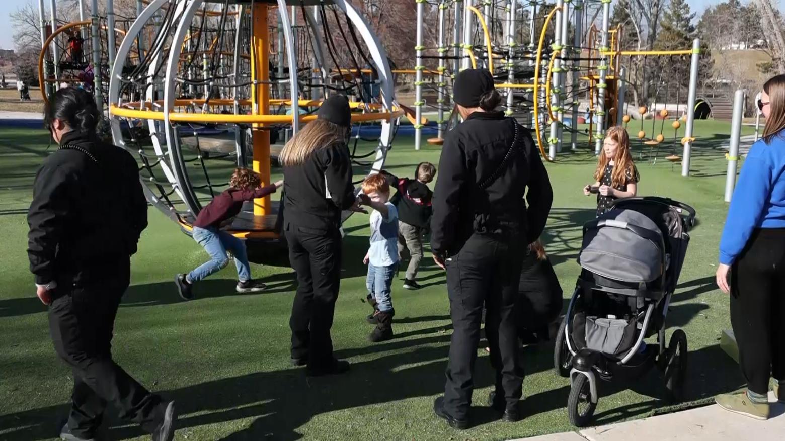 Specialist Debbie Findlay gives a young boy a sticker during PCRT outreach.