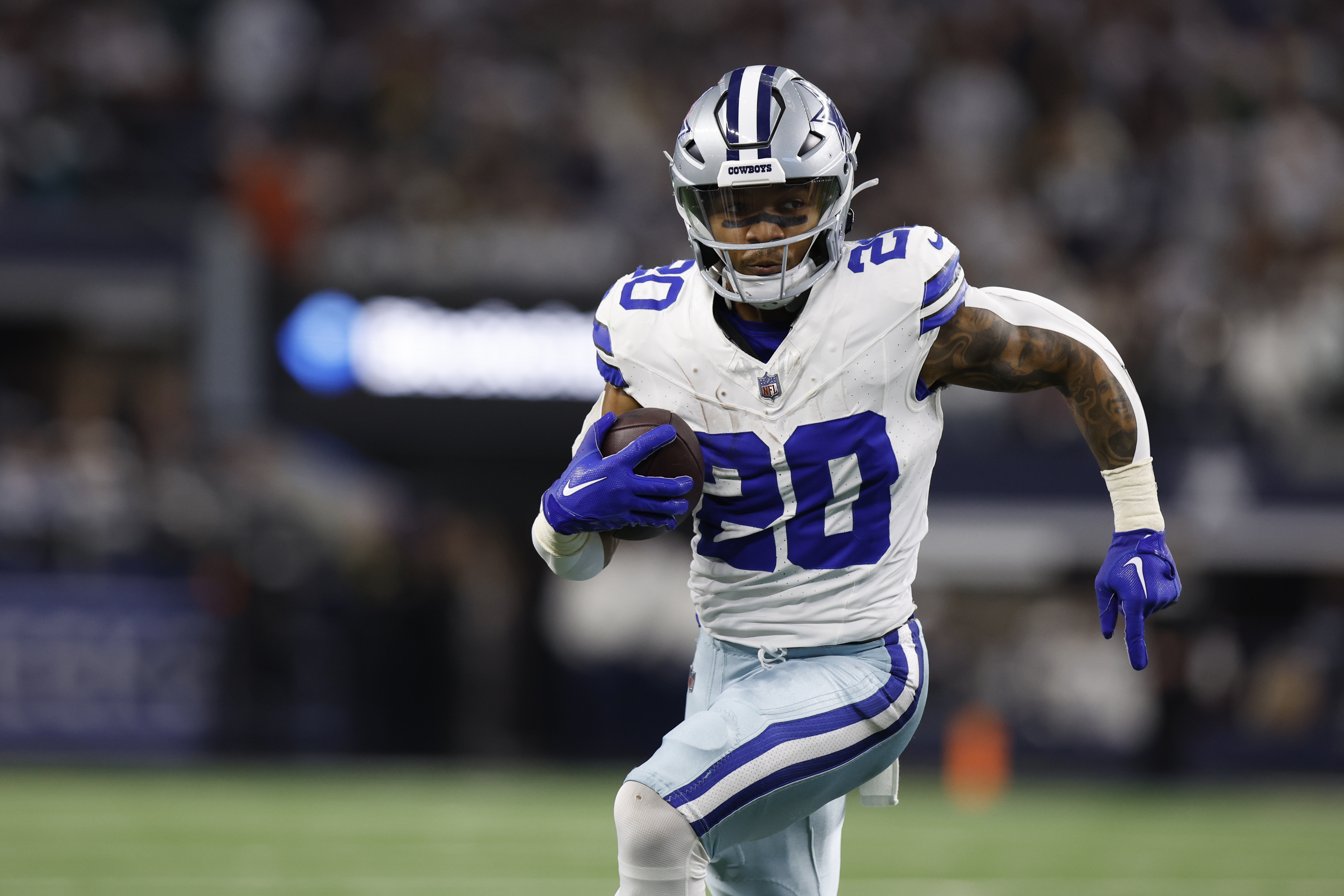 FILE - Dallas Cowboys running back Tony Pollard (20) carries the ball during an NFL wild-card playoff football game, Sunday, Jan. 14, 2024 in Arlington, Texas. Tony Pollard, Derrick Henry, Saquon Barkley, and Josh Jacobs are on the NFL's open market.