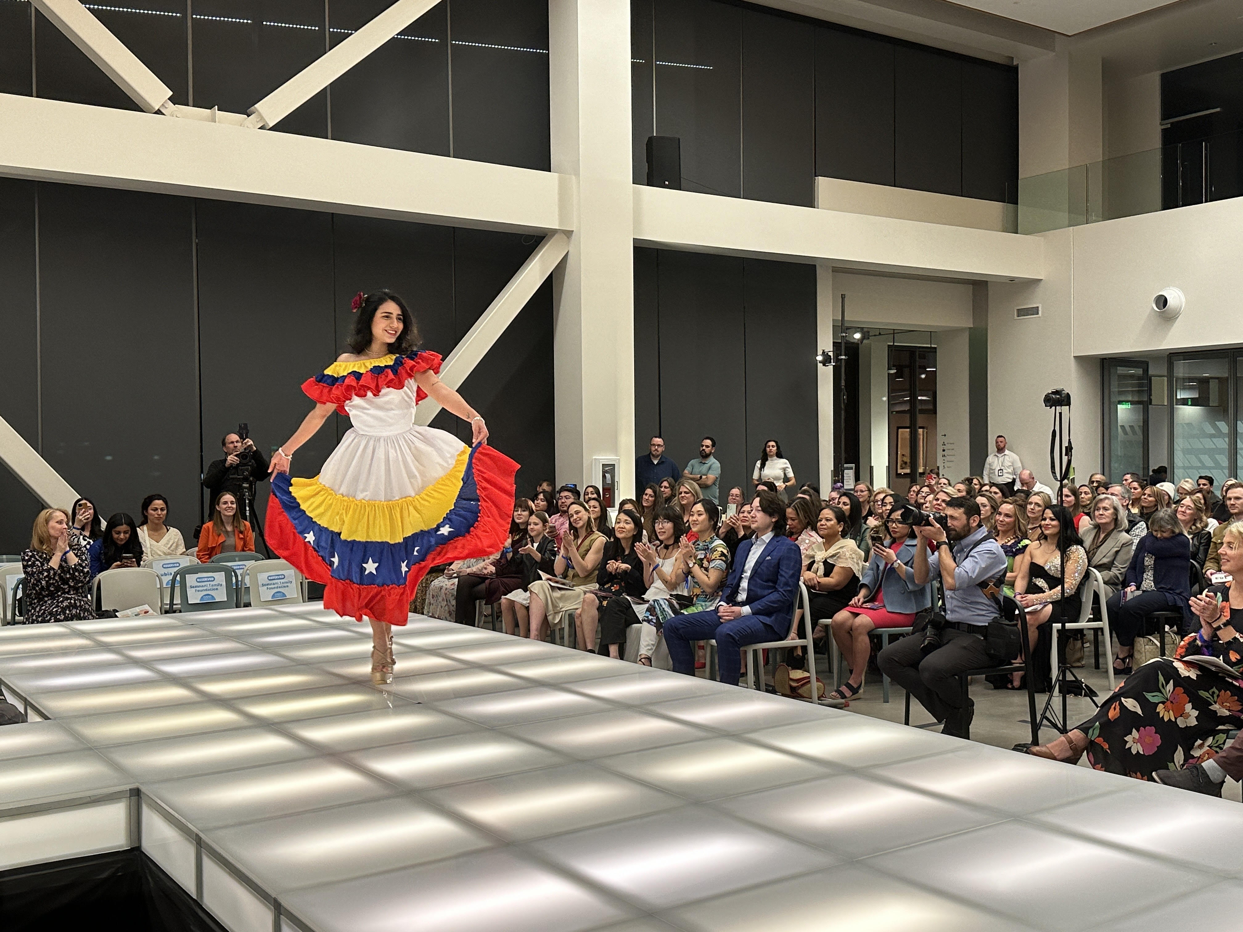 Adrianna Delgado, of Venzuela, walks across the catwalk at the 14th annual Women of the World Fashion Show and Cultural Gala held Wednesday, at the Zions Bancorporation Technology Center in Midvale.