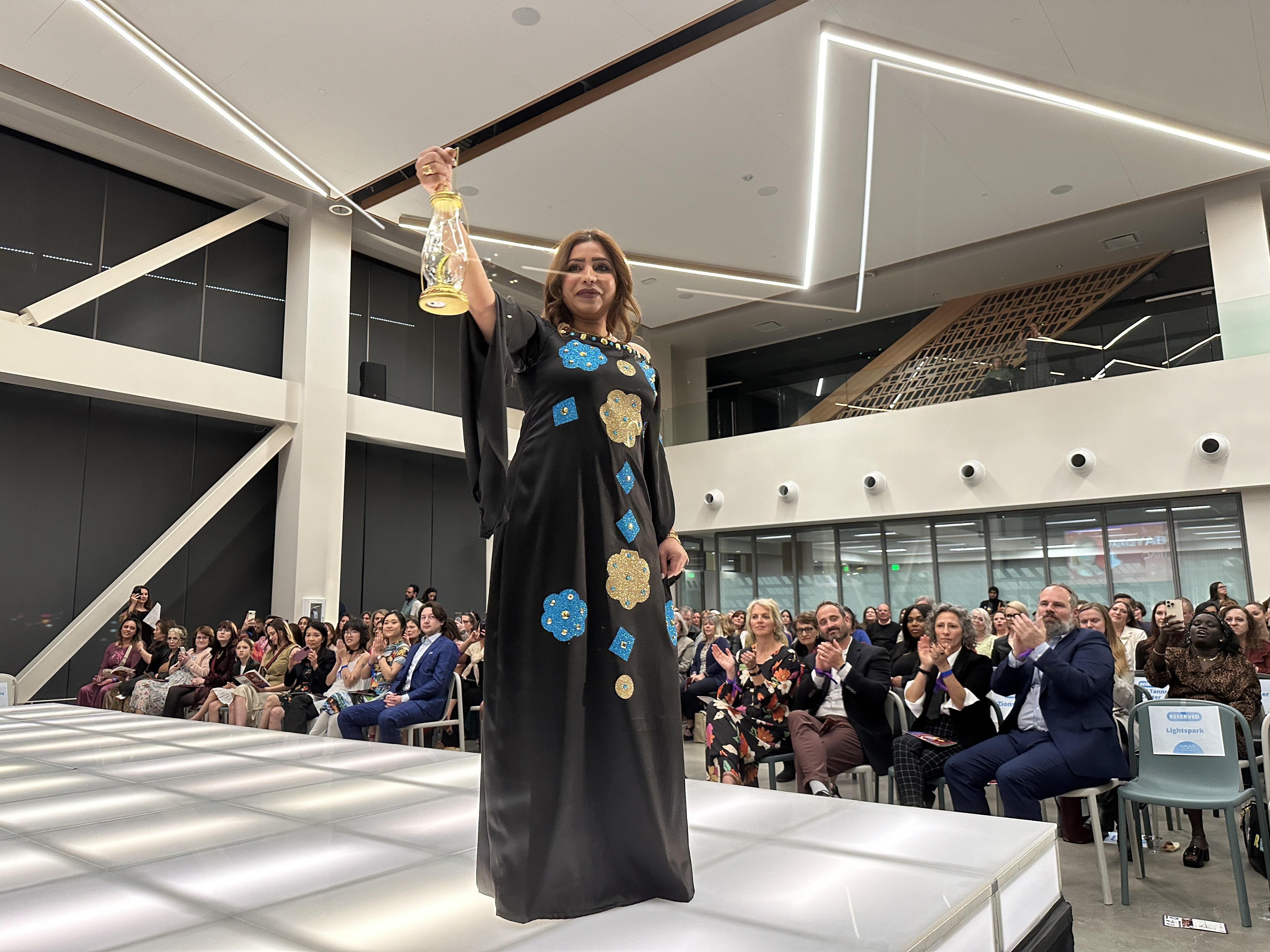 Refugee women celebrate their roots at a fashion show fundraiser