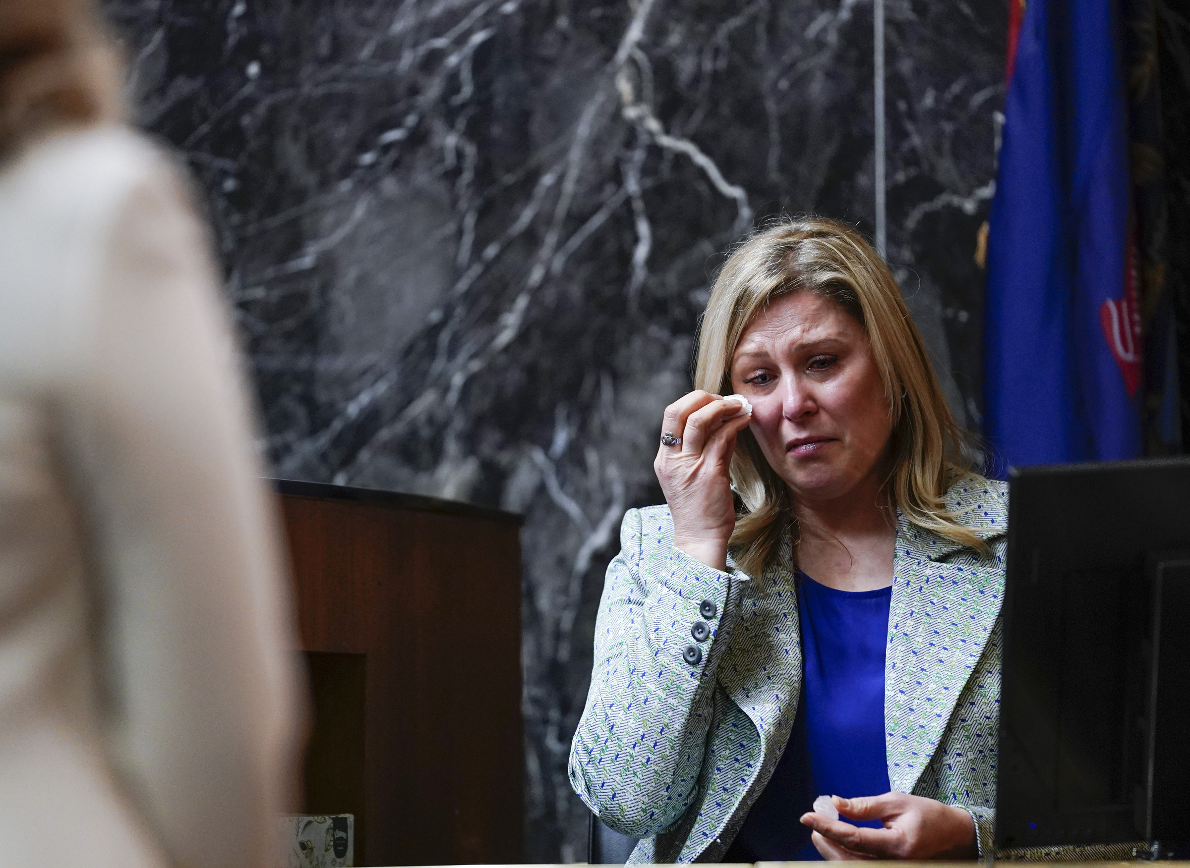 Oxford High School educator Molly Darnell becomes emotional during her testimony at the trial of James Crumbley on Thursday in Pontiac, Mich. James Crumbley, 47, is charged with four counts of involuntary manslaughter, one for each teenager killed by Ethan Crumbley at Oxford High School in 2021.