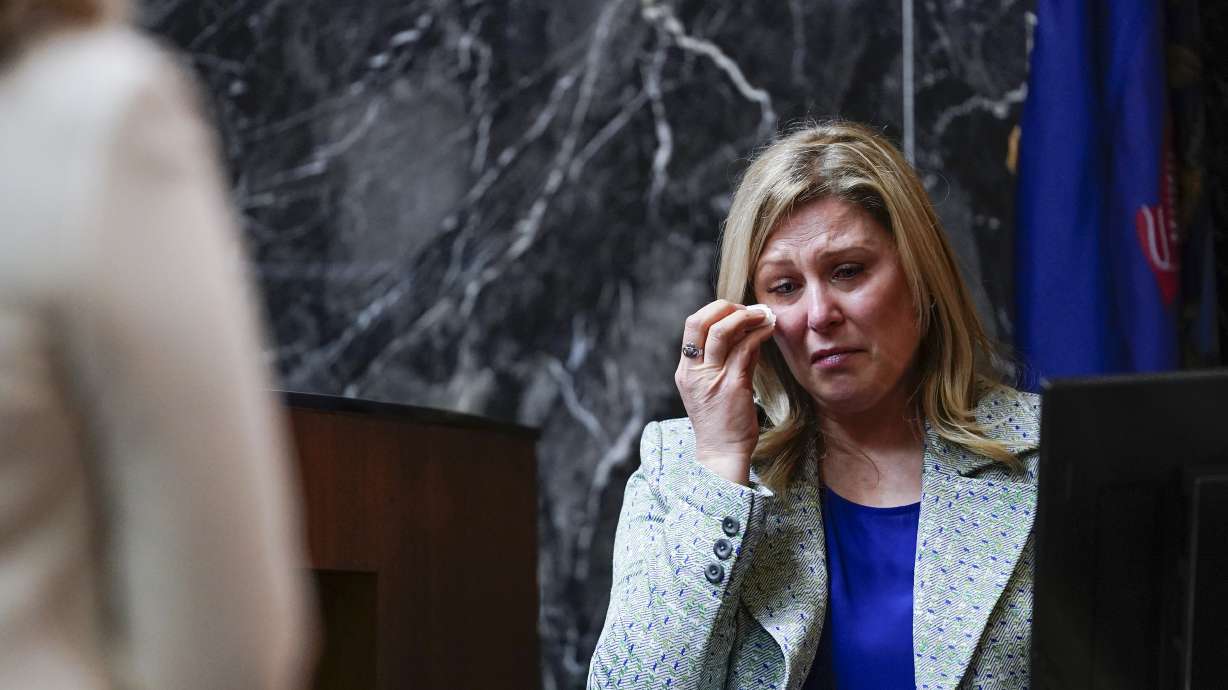 Oxford High School educator Molly Darnell becomes emotional during her testimony at the trial of James Crumbley on Thursday in Pontiac, Mich. James Crumbley, 47, is charged with four counts of involuntary manslaughter, one for each teenager killed by Ethan Crumbley at Oxford High School in 2021.
