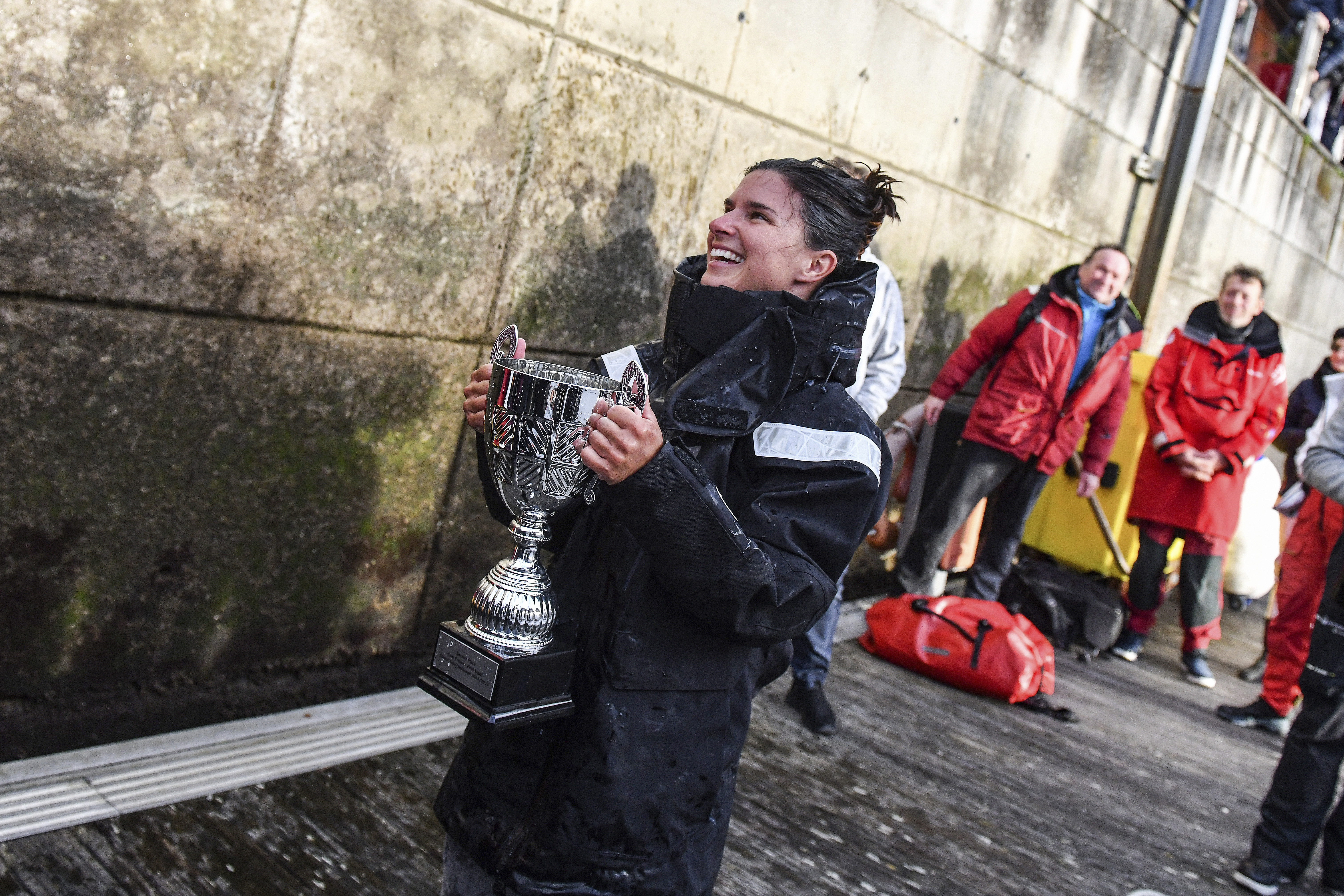 This photo provided by Cole Brauer Ocean Racing shows Brauer as she became the first American woman to race nonstop around the world by herself when she arrived Thursday, March 7, 2024, in A Coruña, Spain. 