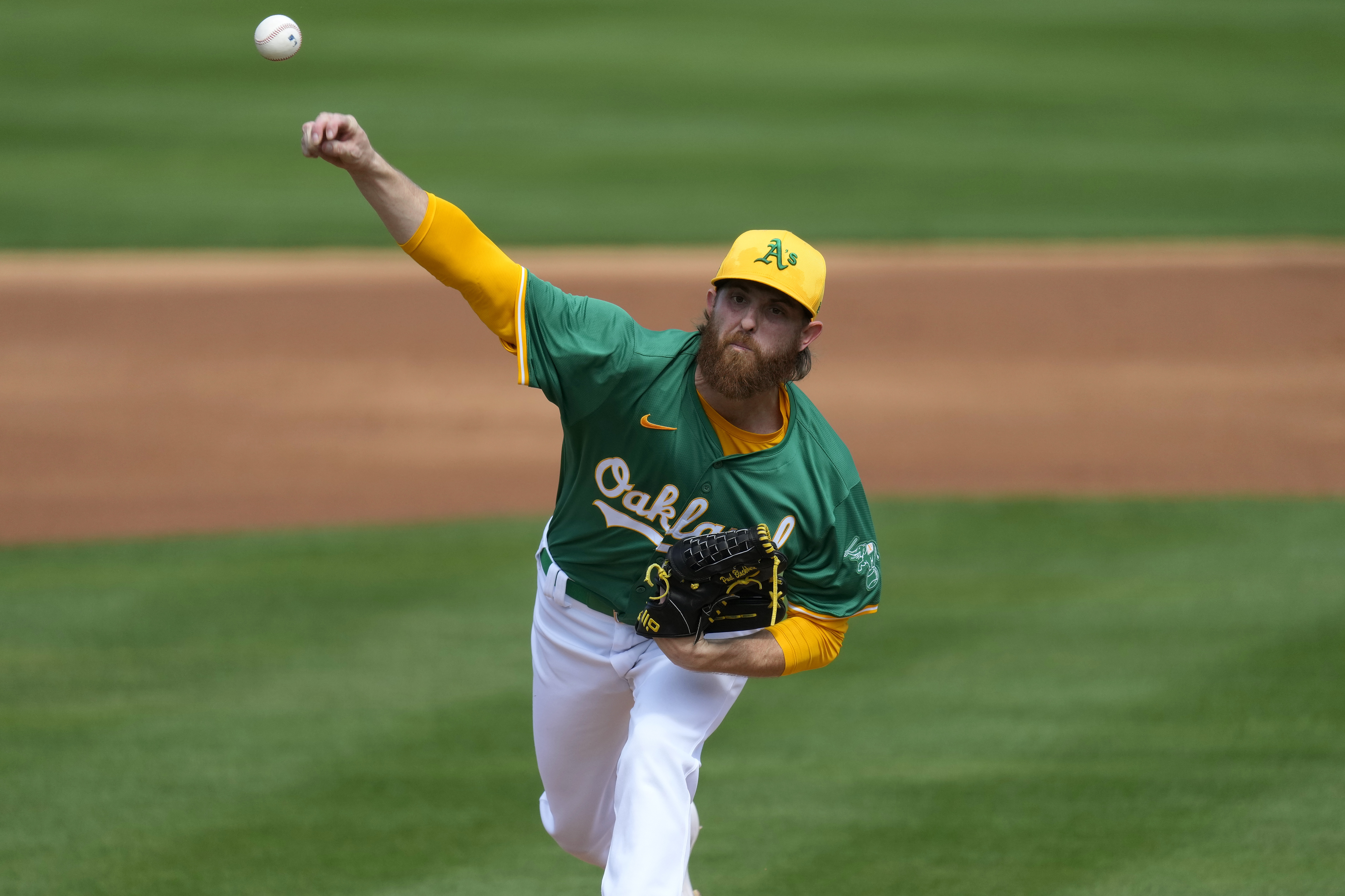 Oakland Athletics starting pitcher Paul Blackburn throws against the San Francisco Giants during the first inning of a spring training baseball game, Wednesday, Feb. 28, 2024, in Mesa, Ariz.