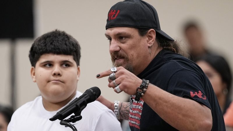Brett Cross, right, speaks at a city council meeting in Uvalde, Texas, Thursday. An investigation Uvalde city leaders ordered into the Robb Elementary School shooting has put no blame on local police officers.