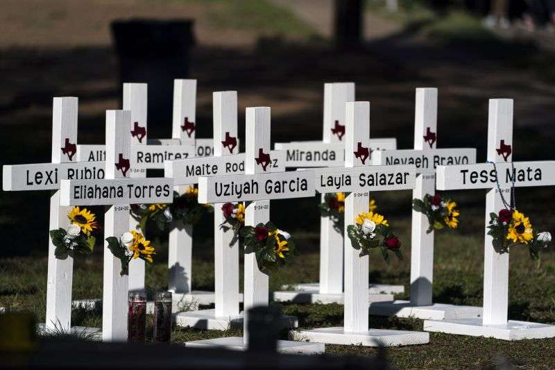 Crosses with the names of shooting victims are placed outside Robb Elementary School in Uvalde, Texas, May 26, 2022.