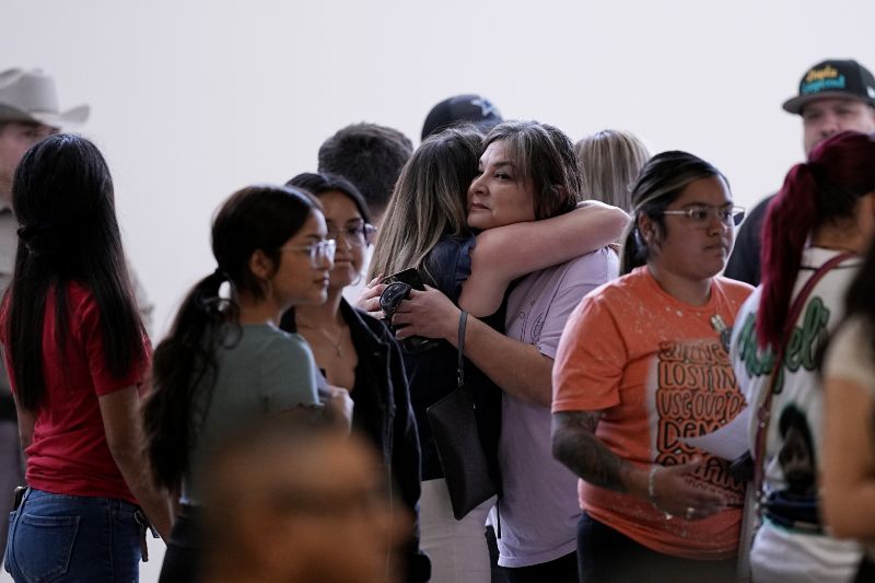Family members arrive for a special city council meeting in Uvalde, Texas, Thursday.