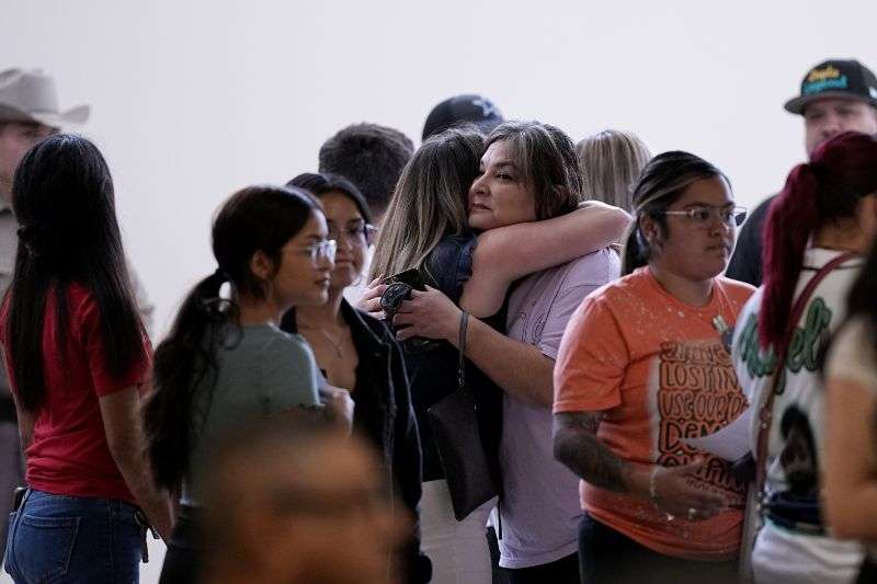 Family members arrive for a special city council meeting in Uvalde, Texas, Thursday.