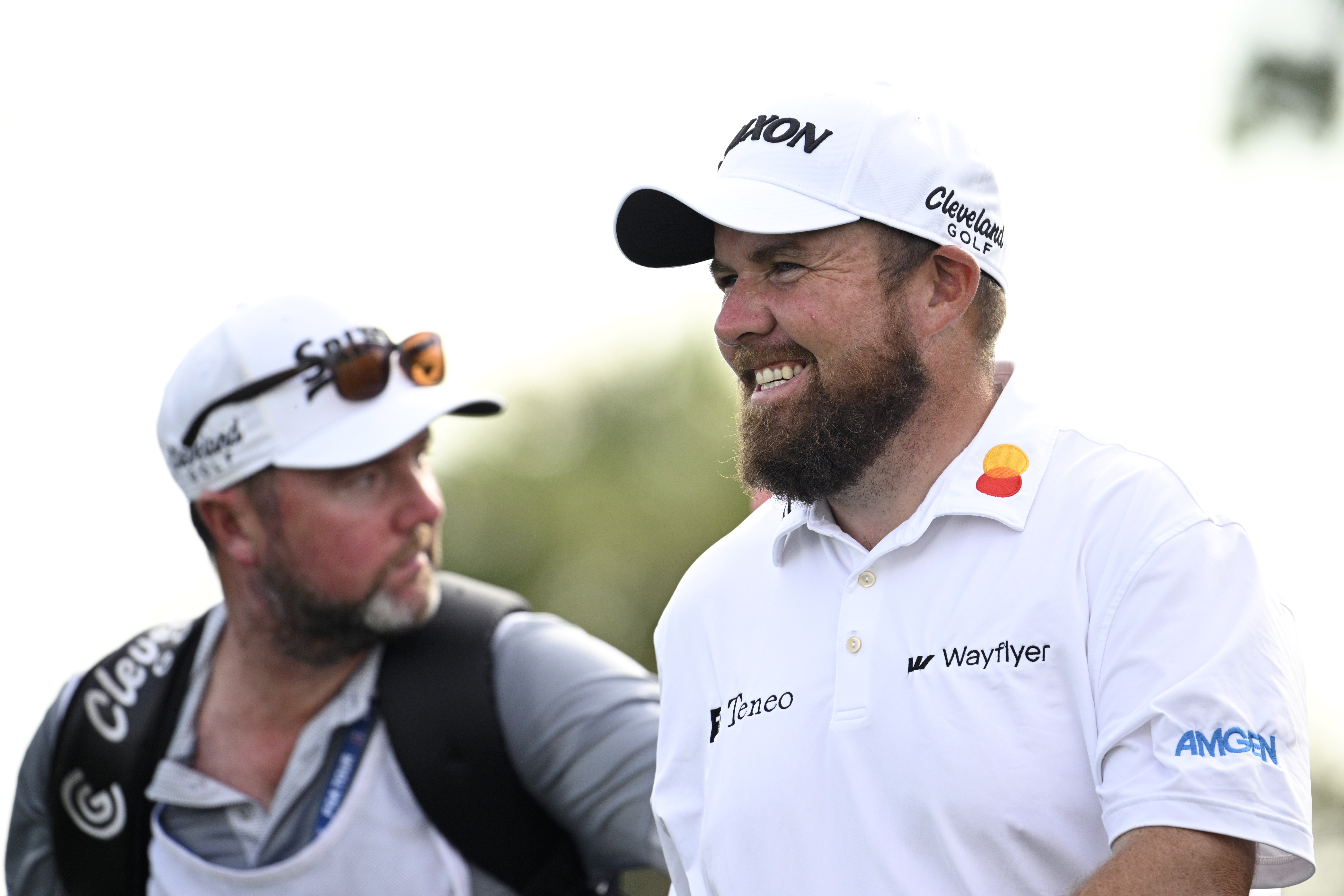 Shane Lowry, right, of Ireland, walks on the 11th fairway after hitting his tee shot during the first round of the Arnold Palmer Invitational golf tournament, Thursday, March 7, 2024, in Orlando, Fla.