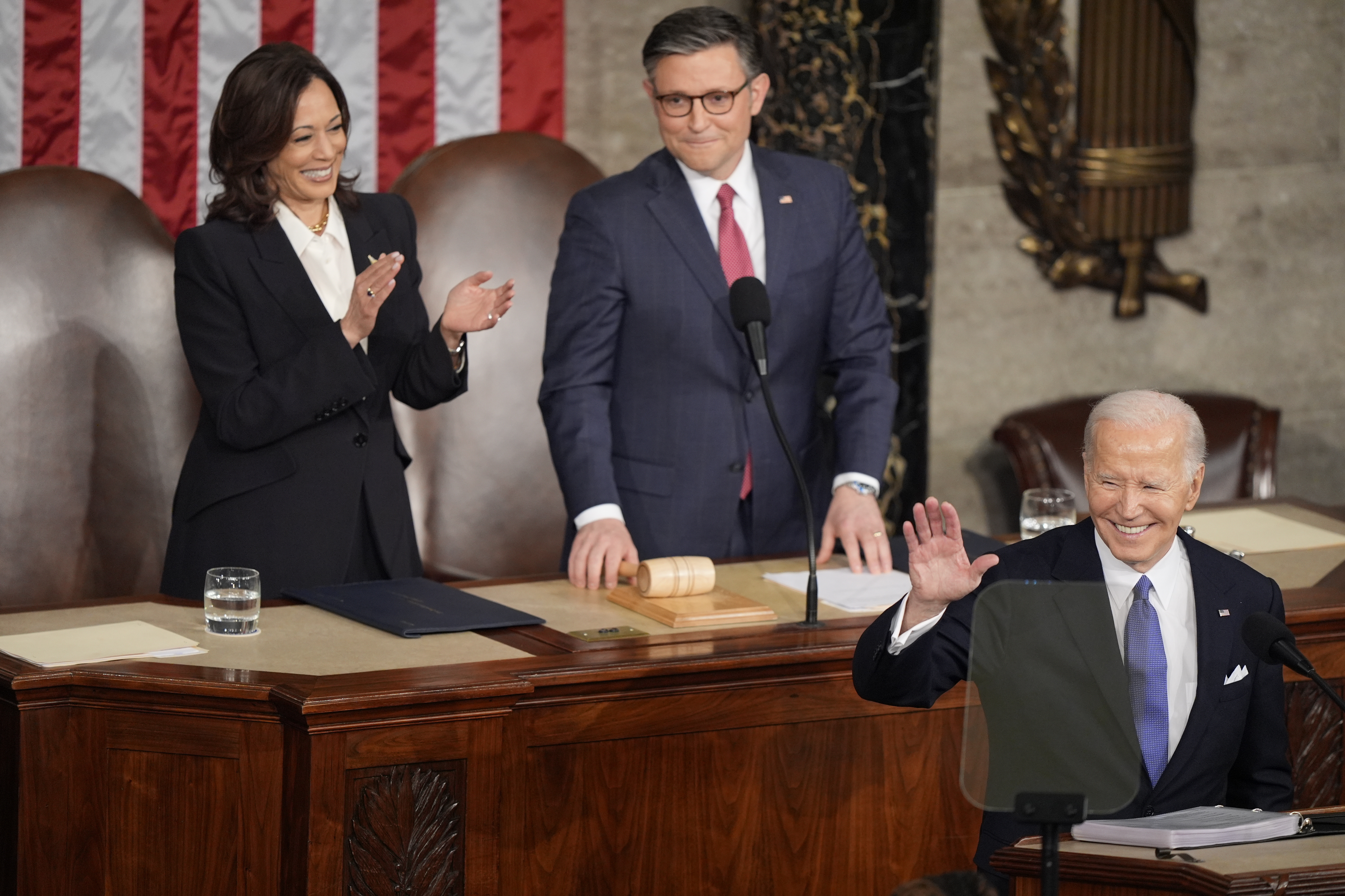 President Joe Biden arrives for the State of the Union address on Capitol Hill, Thursday, in Washington, as Vice President Kamala Harris and House Speaker Mike Johnson of Louisiana, watch.