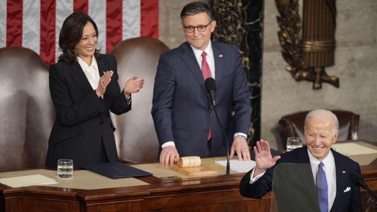 President Joe Biden arrives for the State of the Union address on Capitol Hill, Thursday, in Washington, as Vice President Kamala Harris and House Speaker Mike Johnson of Louisiana, watch.