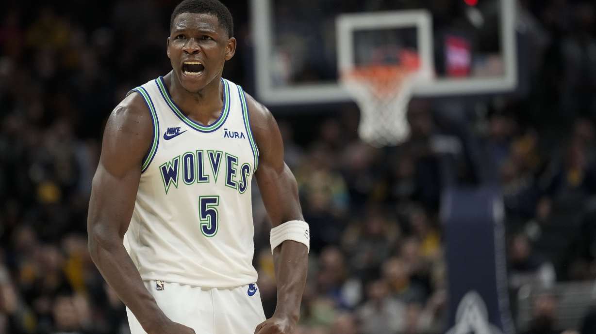 Minnesota Timberwolves guard Anthony Edwards (5) reacts after scoring against the Indiana Pacers during the second half of an NBA basketball game Thursday, March 7, 2024, in Indianapolis. The Timberwolves won 113-111.