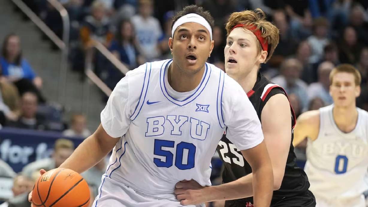 BYU center Aly Khalifa drives to the basket past Denver forward Touko Tainamo during game Dec. 13, 2023, in Provo. Khalifa is one of three Muslim players on this year's BYU roster, who will begin observing Ramadan on Sunday.