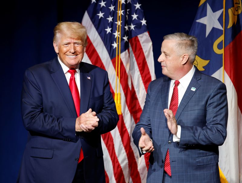Former U.S. President Donald Trump is introduced by then North Carolina Republican Party chairman Michael Whatley before speaking at the North Carolina GOP convention dinner in Greenville, North Carolina on June 5, 2021.