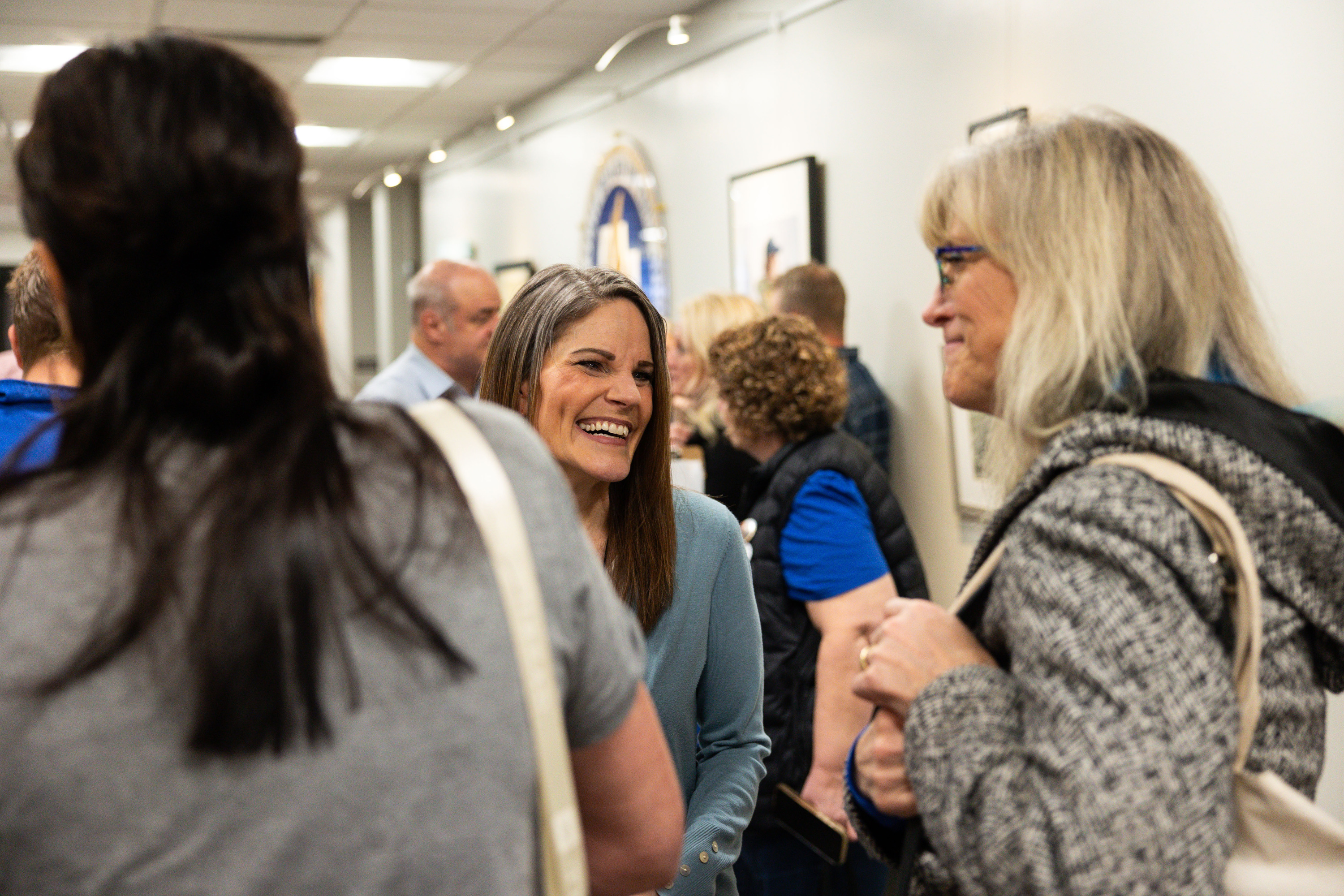 Natalie Cline talks to those who came to support to her at the monthly meeting for the Utah State Board of Education, the first since the board voted to censure and strip Cline of her committee assignments, in Salt Lake City on Thursday.