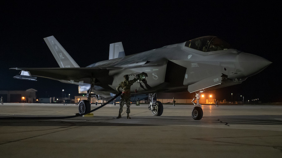 An Airman monitors an F-35A Lightning II during a hot pit refuel at Hill Air Force Base during night flying operations. Training flights are scheduled to begin Monday.