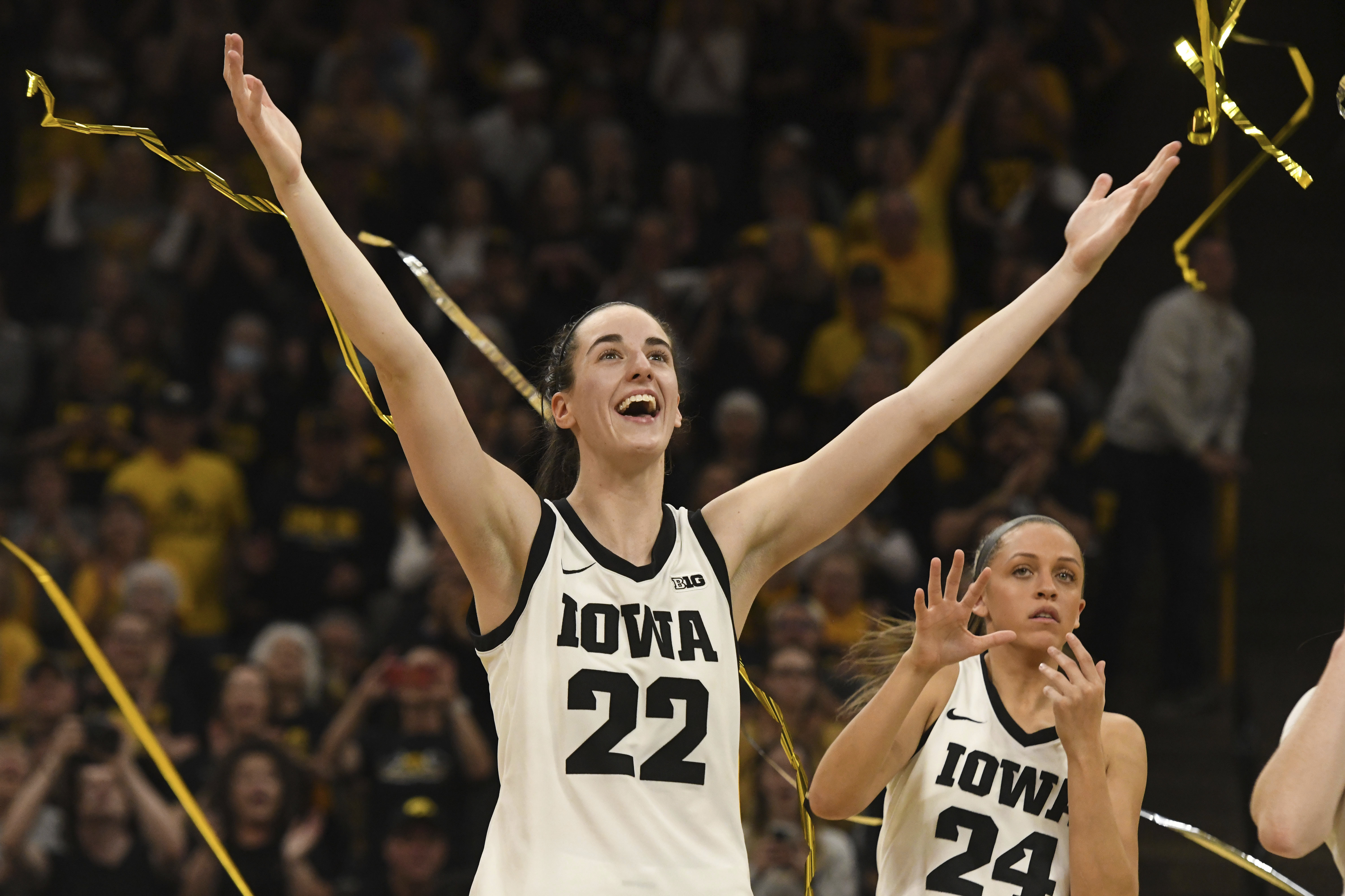 Iowa guard Caitlin Clark (22) celebrates during Senior Day ceremonies following a victory over Ohio State in an NCAA college basketball game, Sunday, March 3, 2024, in Iowa City, Iowa. 