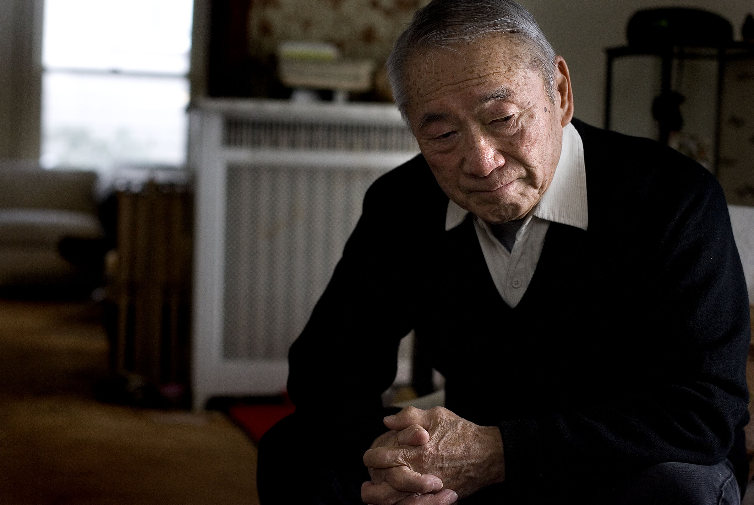Raymond Uno, a retired judge, seen here Dec. 1, 2010, was sent to a Wyoming internment camp when he was young; his father died in the camps. Uno died Friday at 93.