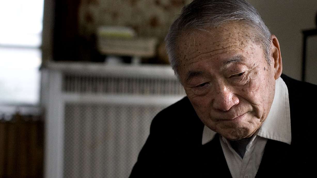 Raymond Uno, a retired judge, seen here Dec. 1, 2010, was sent to a Wyoming internment camp when he was young; his father died in the camps. Uno died Friday at 93.