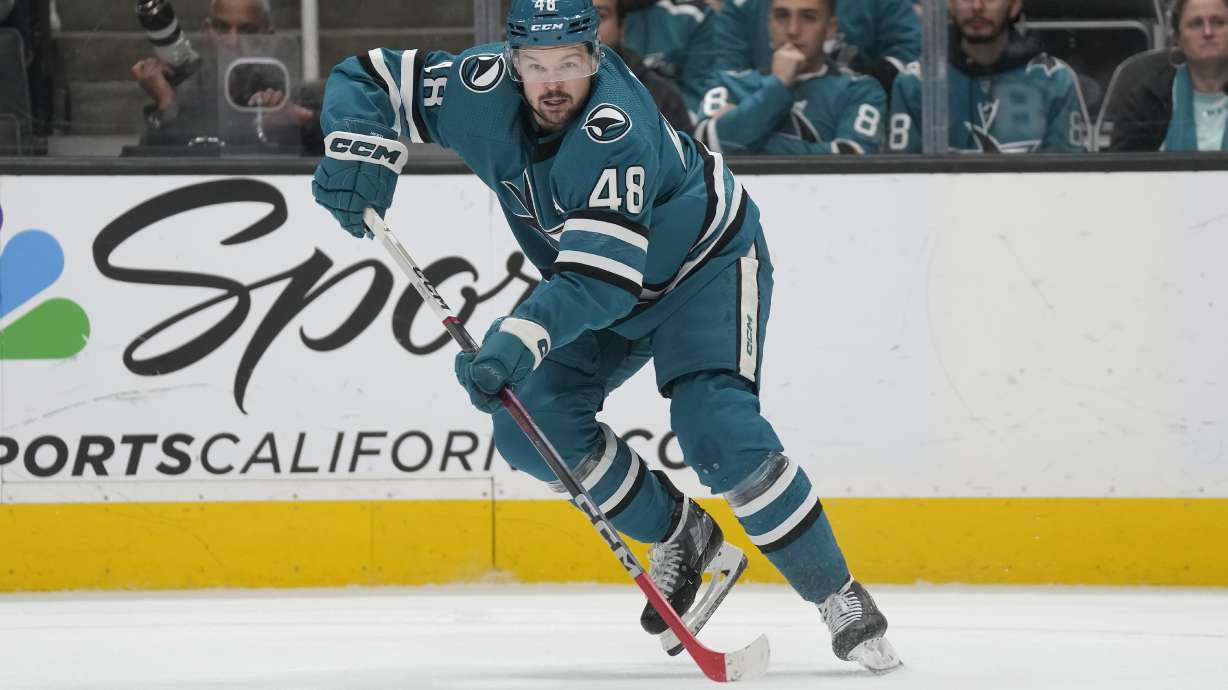 FILE San Jose Sharks center Tomas Hertl skates with the puck against the Los Angeles Kings during the second period of an NHL hockey game in San Jose, Calif., Tuesday, Dec. 19, 2023. The defending Stanley Cup champion Vegas Golden Knights acquired Hertl from San Jose in what so far stands as the biggest deal made on the final day of NHL trading, Friday, March 8, 2024.