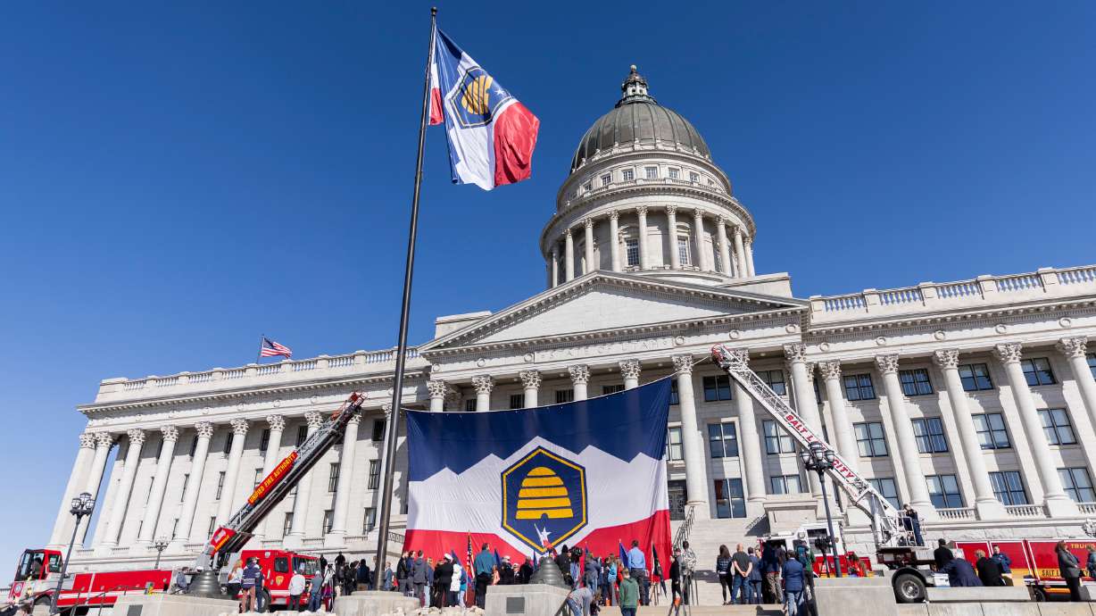 Utah's new state flag flies in front of the state Capitol for the first time after a celebration to commemorate Utah Flag Day in Salt Lake City on Saturday.