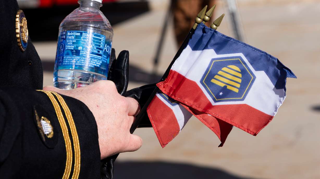 Flags are passed out to the public during the commemoration of Utah Flag Day at the state Capitol in Salt Lake City on Saturday. A federal judge on Monday denied a preliminary injunction in a lawsuit that organizers of a flag initiative filed against the state over its initiative laws.