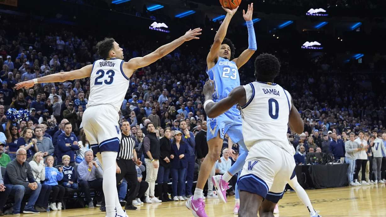 Creighton's Trey Alexander, center, goes up for the go-ahead basket between Villanova's Tyler Burton, left, and TJ Bamba during the final seconds of an NCAA college basketball game, Saturday, March 9, 2024, in Philadelphia.