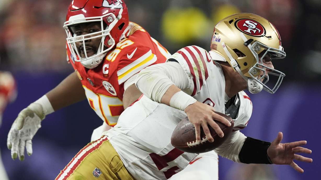 Kansas City Chiefs defensive tackle Chris Jones (95) chases San Francisco 49ers quarterback Brock Purdy (13) during the second half of the NFL Super Bowl 58 football game Sunday, Feb. 11, 2024, in Las Vegas.