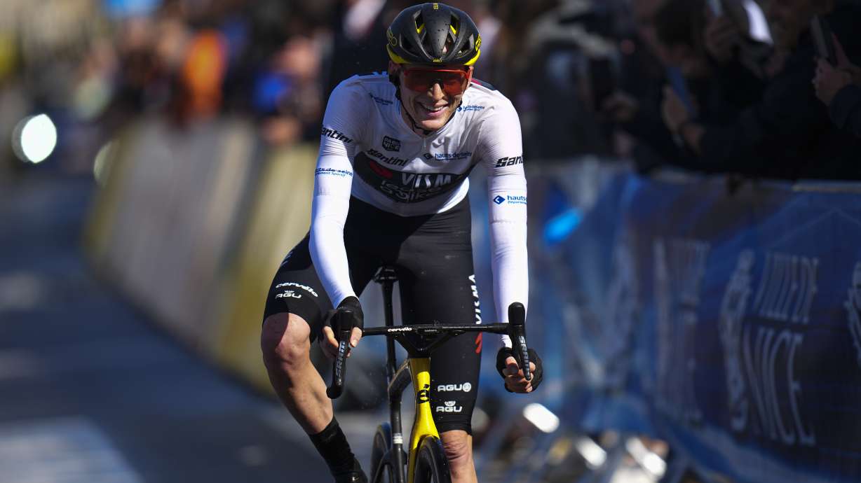 Matteo Jorgensen of the U.S. crosses the finish line to win the general clasification during the eighth and final stage of the Paris-Nice cycling race in Nice, Sunday, March 10, 2024.