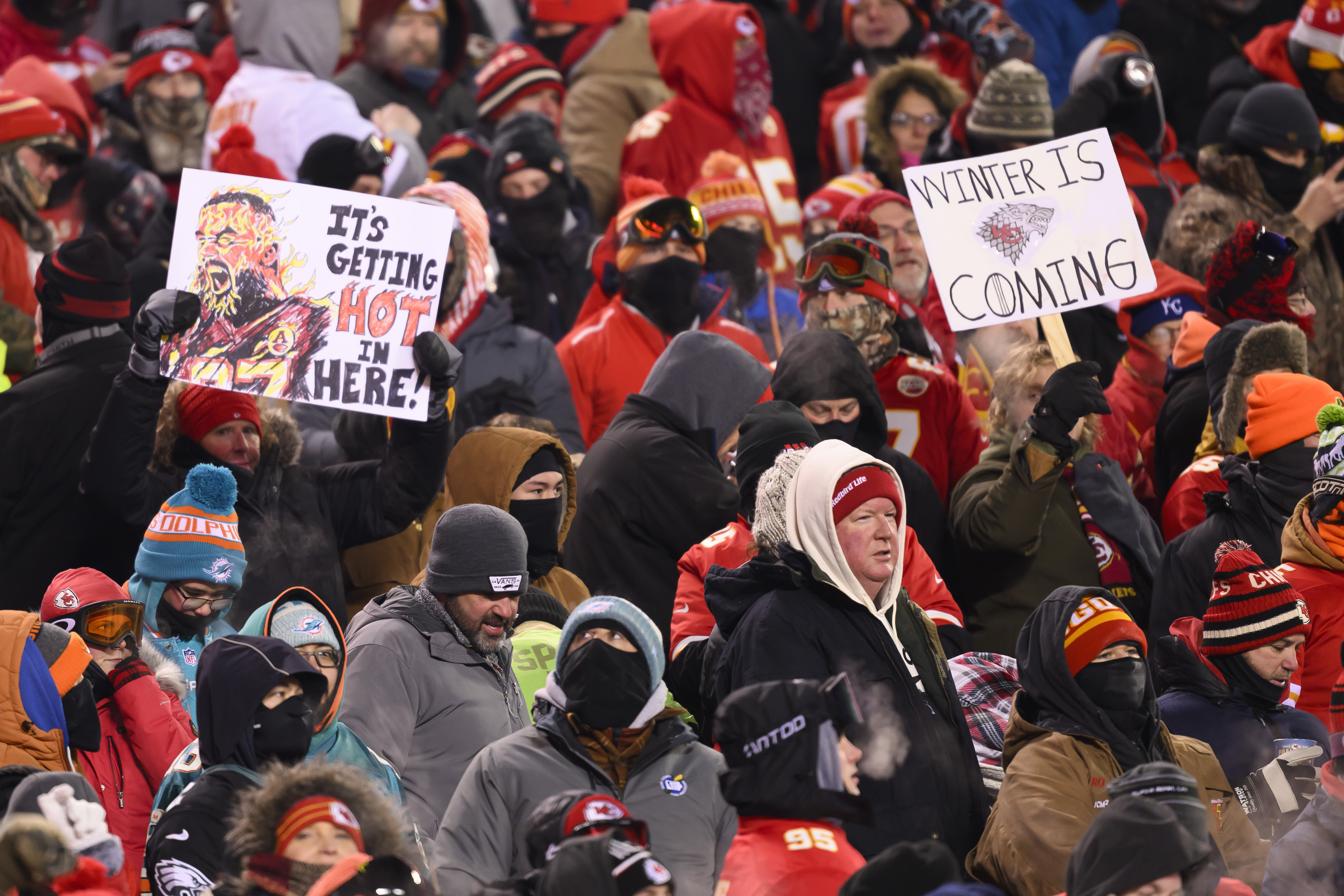 FILE - Kansas City Chiefs fans who braved sub-zero temperatures celebrate after a touchdown against the Miami Dolphins during the first half of an NFL wild-card playoff football game, Saturday, Jan. 13, 2024 in Kansas City, Mo. Some of the people who attended the near-record cold Chiefs playoff game in January had to undergo amputations, a Missouri hospital said Friday, March 8, 2024. Research Medical Center didn’t provide exact numbers but said in a statement Friday that some of the 12 people who had to undergo amputations after the cold snap had been at the game. 