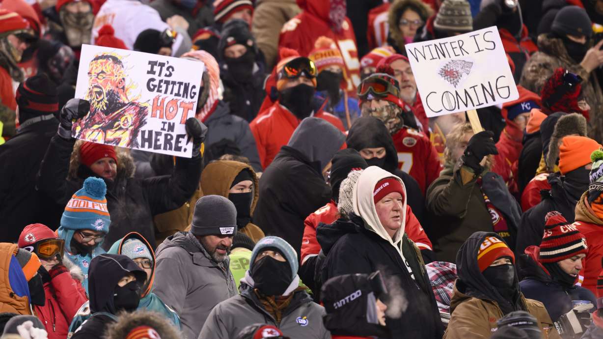 FILE - Kansas City Chiefs fans who braved sub-zero temperatures celebrate after a touchdown against the Miami Dolphins during the first half of an NFL wild-card playoff football game, Saturday, Jan. 13, 2024 in Kansas City, Mo. Some of the people who attended the near-record cold Chiefs playoff game in January had to undergo amputations, a Missouri hospital said Friday, March 8, 2024. Research Medical Center didn’t provide exact numbers but said in a statement Friday that some of the 12 people who had to undergo amputations after the cold snap had been at the game.