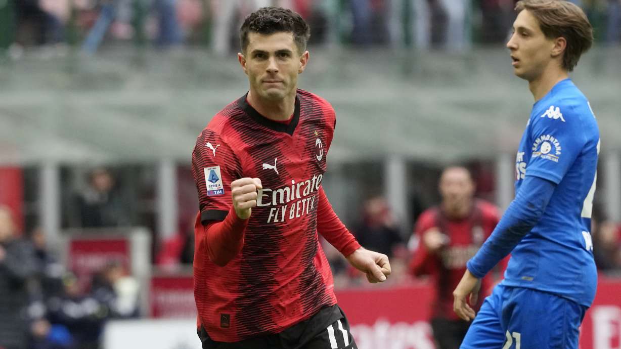 AC Milan's Christian Pulisic celebrates after scoring his side's opening goal during a Serie A soccer match between AC Milan and Empoli at the San Siro stadium in Milan, Italy, Sunday, March 10, 2024.