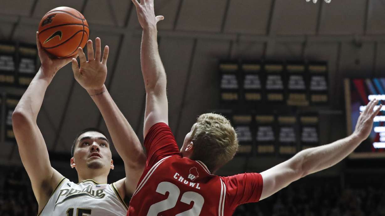 Purdue center Zach Edey (15) shoots the ball over Wisconsin forward Steven Crowl (22) during the NCAA men's basketball game, Sunday, March 10, 2024, at Mackey Arena in West Lafayette, Ind. Purdue won 78-70.