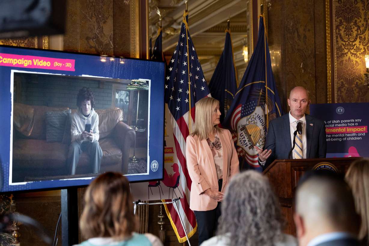Aimee Winder Newton, senior adviser to Gov. Spencer Cox and director of the Office of Families, left, and Cox announce the launch of a new public awareness campaign urging parents to learn about the harms social media has on youth at the Capitol in Salt Lake City on Aug. 3, 2023.