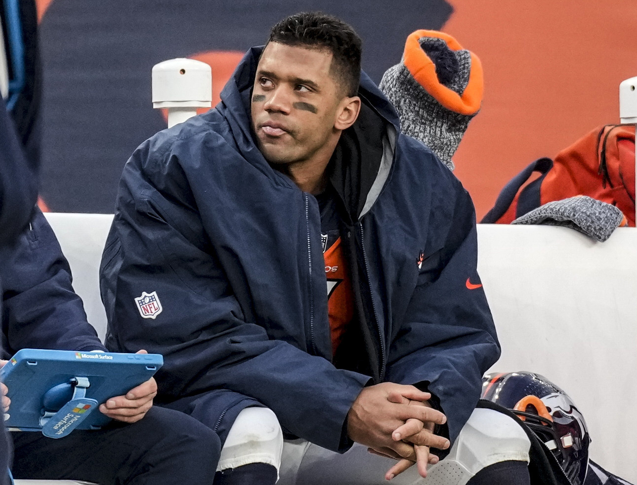 FILE - Denver Broncos quarterback Russell Wilson sits on the bench during the second half of an NFL football game against the Los Angeles Chargers, Sunday, Dec. 31, 2023, in Denver. Wilson has agreed to sign a one-year deal with the Pittsburgh Steelers, a person familiar with the details told The Associated Press on Sunday night, March 10, 2024. 