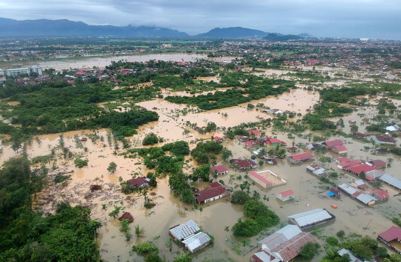 A drone view shows a residential area affected by floods due to heavy rains in Padang, West Sumatra province, Indonesia, Friday.