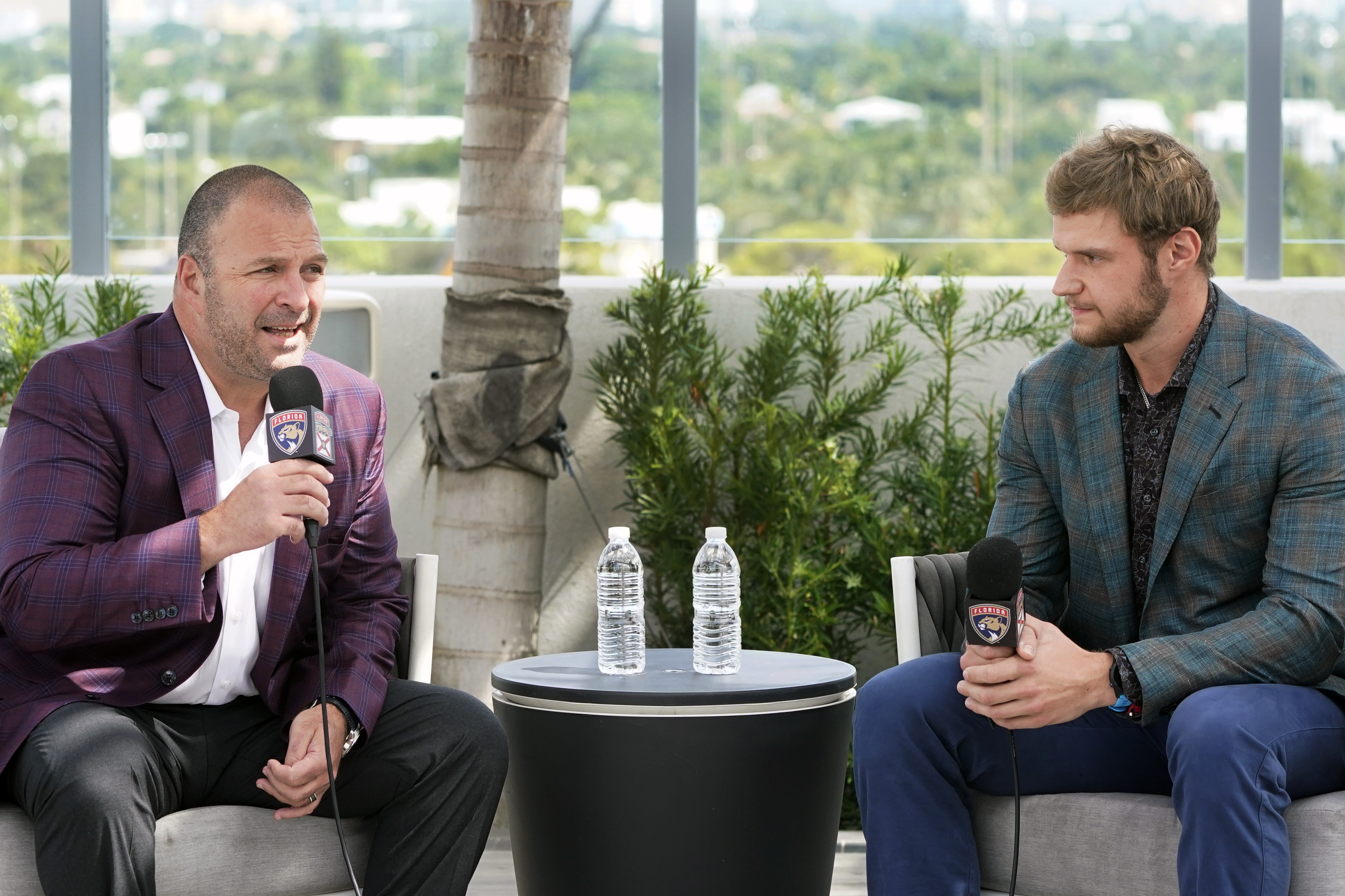 FILE - Florida Panthers general manager Bill Zito, left, speaks alongside center Aleksander Barkov, during an NHL hockey news conference, Friday, Oct. 8, 2021, in Fort Lauderdale, Fla. Florida Panthers general manager Bill Zito has his team in position to have the best record in the NHL for the second time in three years. And his four seasons in Florida have arguably been the best four-year run in team history. 