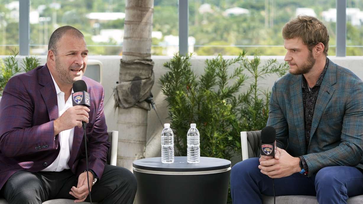FILE - Florida Panthers general manager Bill Zito, left, speaks alongside center Aleksander Barkov, during an NHL hockey news conference, Friday, Oct. 8, 2021, in Fort Lauderdale, Fla. Florida Panthers general manager Bill Zito has his team in position to have the best record in the NHL for the second time in three years. And his four seasons in Florida have arguably been the best four-year run in team history.