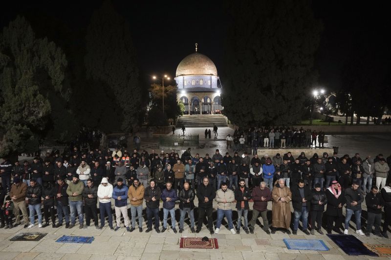 Muslim worshippers perform "tarawih," an extra lengthy prayer held during the Muslim holy month of Ramadan, next to the Dome of Rock at the Al-Aqsa Mosque compound in the Old City of Jerusalem, Sunday.