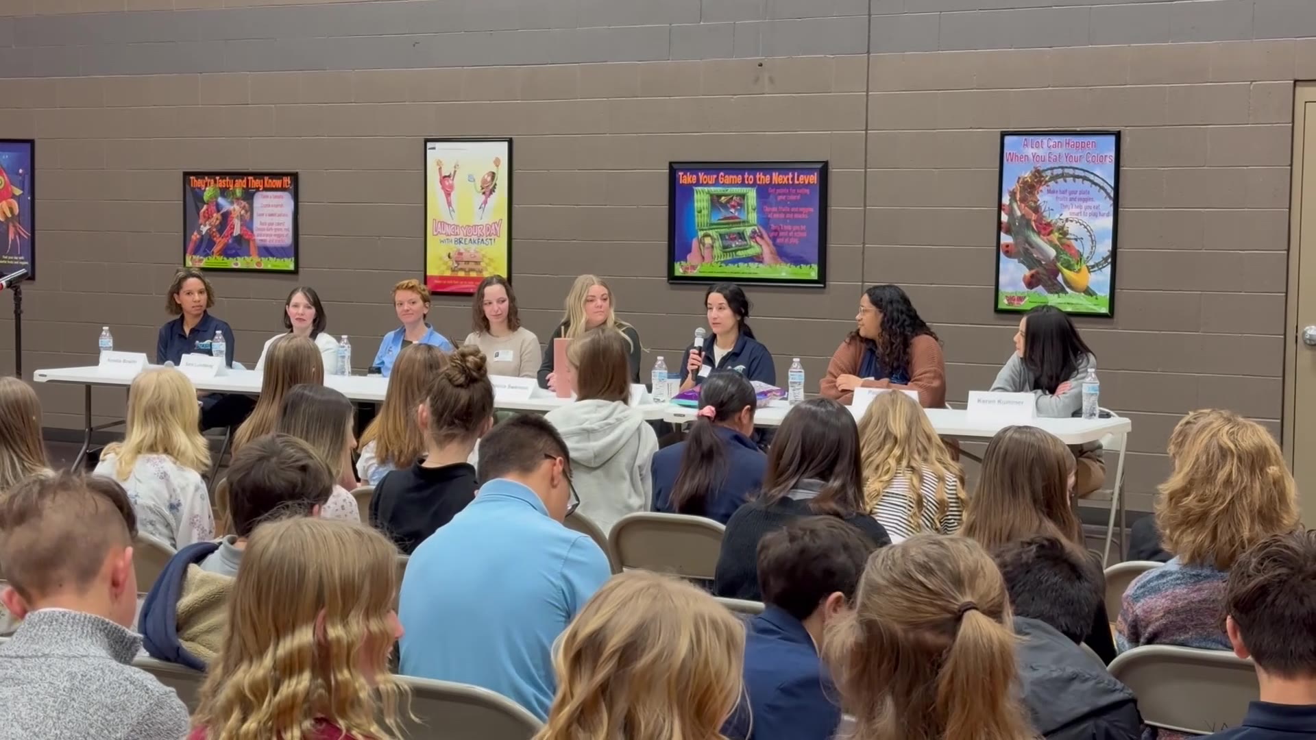 The STEM panelists speaking to students at Voyage Academy in Clinton.