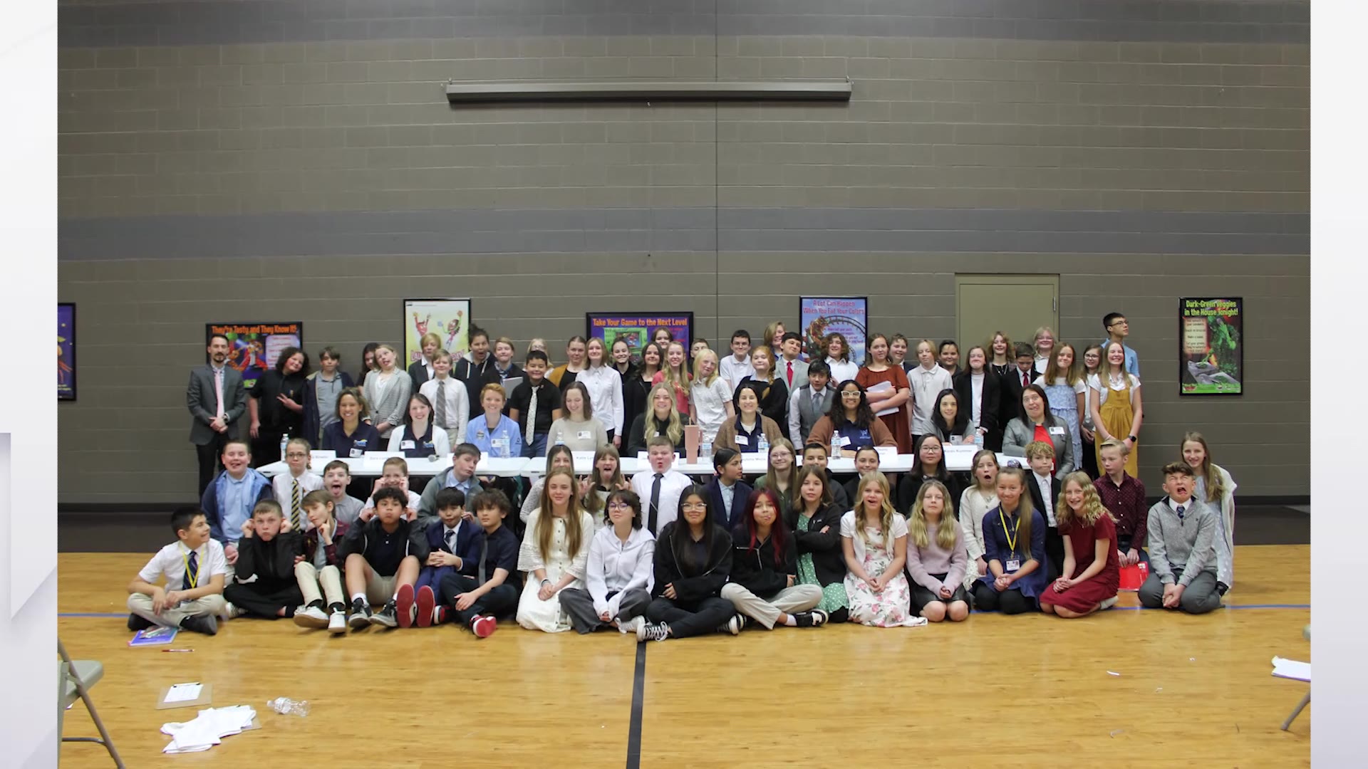 The panelists and students take a group photo with each other at Voyage Academy in Clinton.