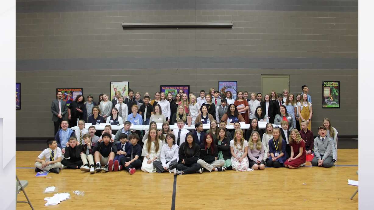 The panelists and students take a group photo with each other at Voyage Academy in Clinton.
