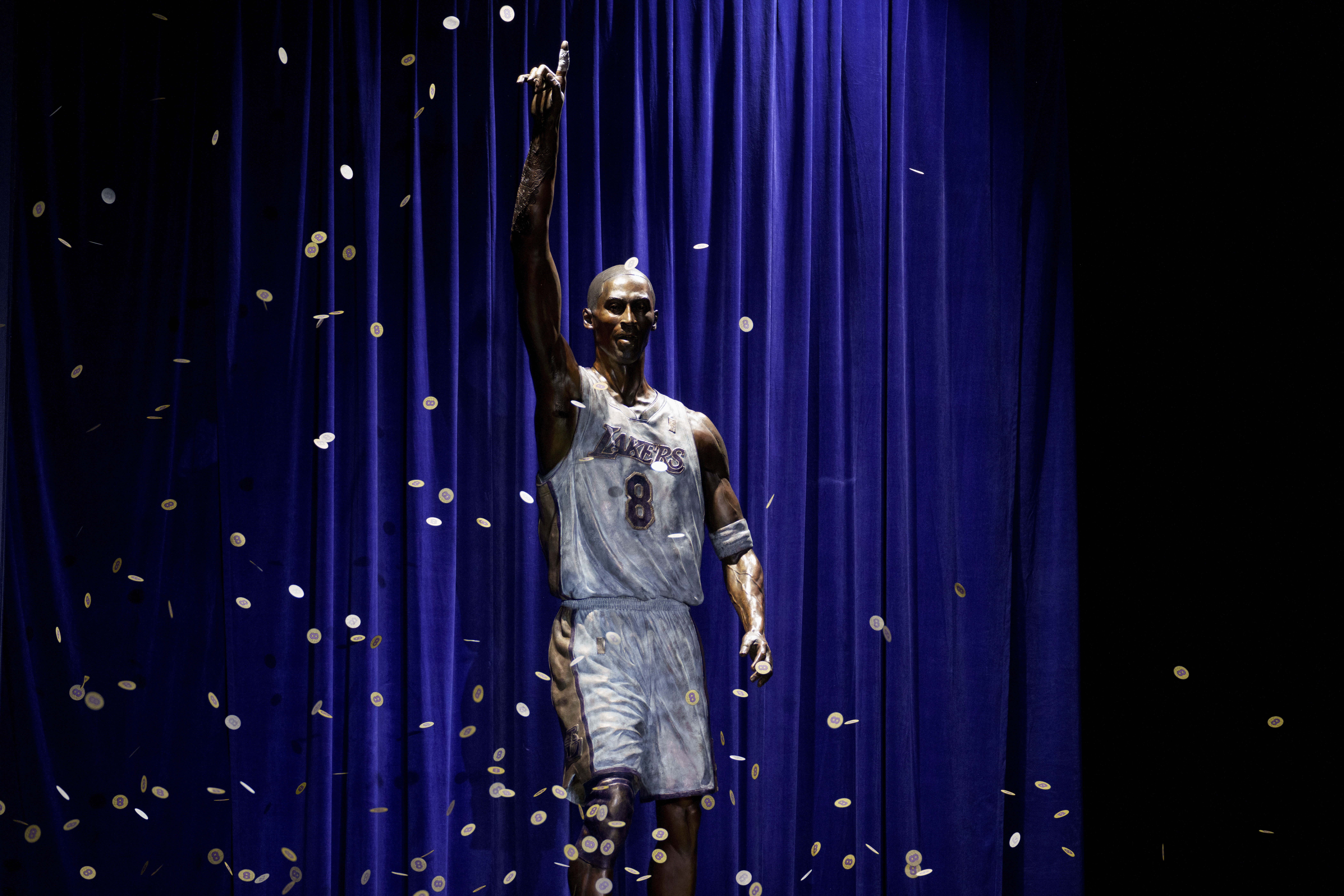 FILE - A statue in honor of former Los Angeles Lakers guard Kobe Bryant is displayed after being unveiled in a ceremony outside the NBA basketball team's arena, Feb. 8, 2024, in Los Angeles. The Lakers say they're planning to fix a handful of errors on the base of the statue of Kobe Bryant unveiled last month outside their arena. 
