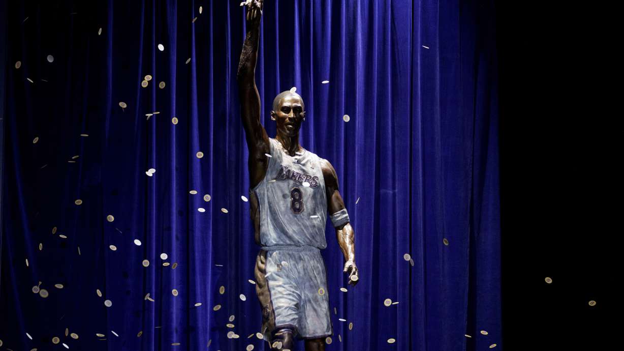 FILE - A statue in honor of former Los Angeles Lakers guard Kobe Bryant is displayed after being unveiled in a ceremony outside the NBA basketball team's arena, Feb. 8, 2024, in Los Angeles. The Lakers say they're planning to fix a handful of errors on the base of the statue of Kobe Bryant unveiled last month outside their arena.