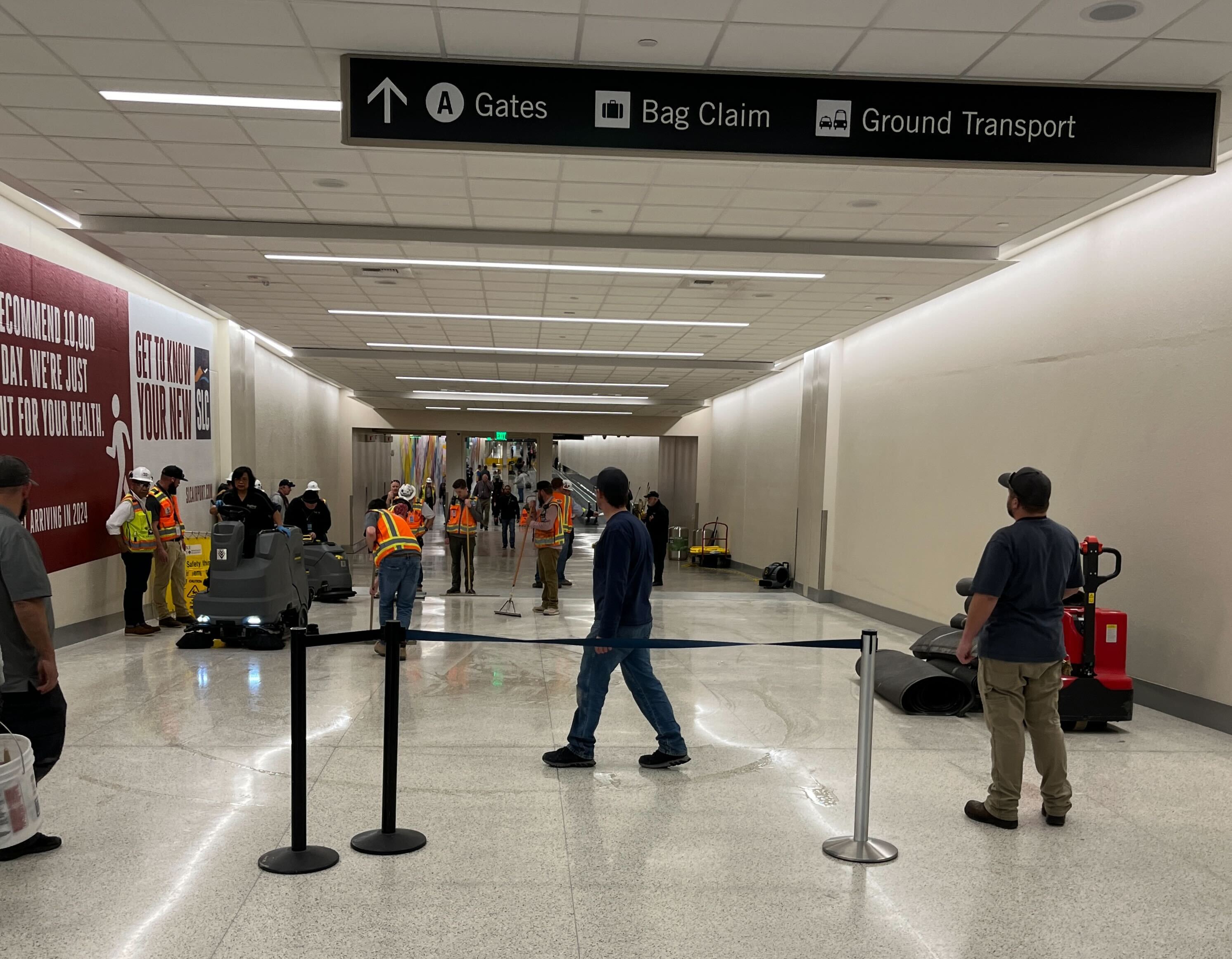 Air travel passengers were diverted through a utility corridor to avoid a groundwater leak that shut down the underground tunnel connecting concourses A and B at the Salt Lake City International Airport on Monday. 