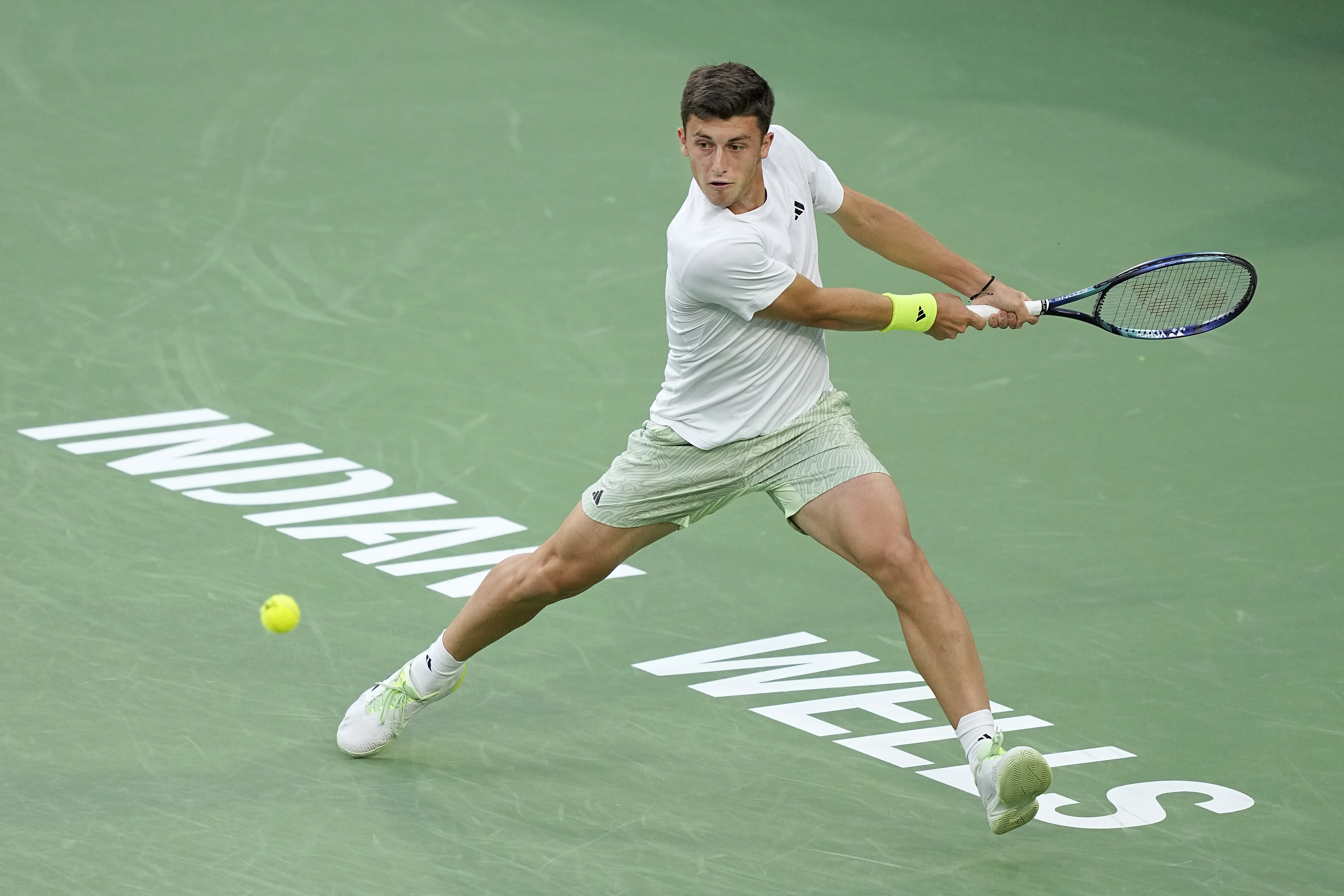 Luca Nardi, of Italy, returns a shot against Novak Djokovic, of Serbia, at the BNP Paribas Open tennis tournament, Monday, March 11, 2024, in Indian Wells, Calif. 