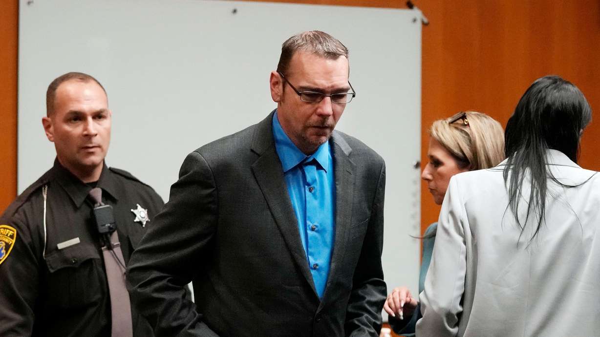 James Crumbley is escorted out of the Oakland County courtroom Friday in Pontiac, Mich. A detective testified at his manslaughter trial Tuesday.
